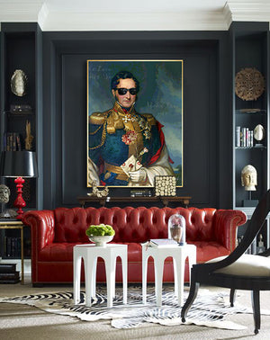 Make Love Not War, a print by Jackie Von Tobel that features a decorated military man �� la Emperor Napoleon holding a rose and a love letter, in a livingroom setting above a deep red leather sofa