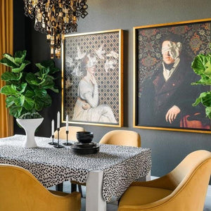 See No Evil by Jackie Von Tobel is a fine art giclée of a gentleman whose vision is obscured by an artfully tied bow made of satin, in a modern dining room setting hanging.